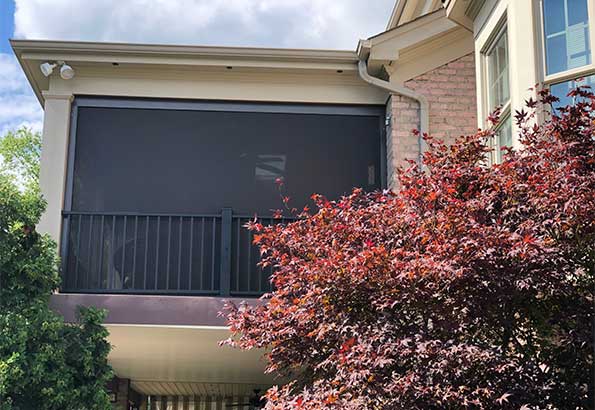solar-screens-with-side-rails-behind-porch-railing